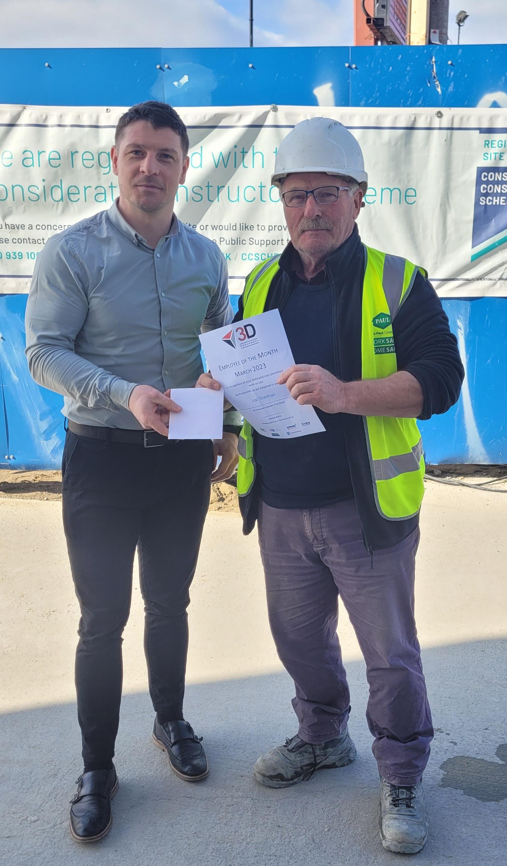 3D Director Brian Curran presents the Employee of the Month award to Val Sheehan