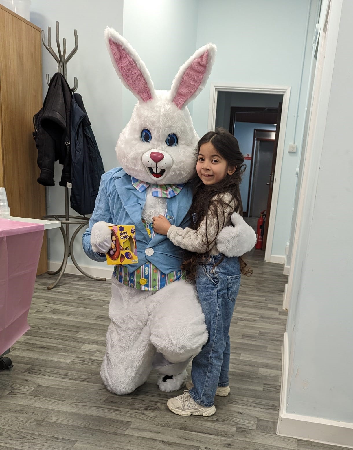 The Easter Bunny with one of the children at the event