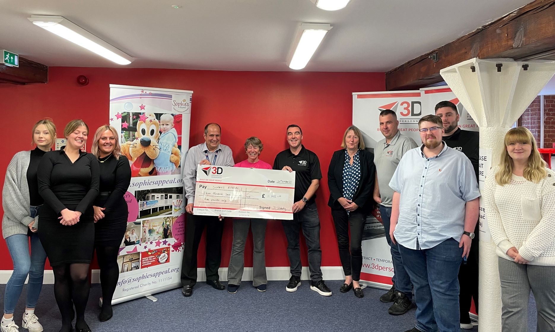 3D Personnel, Managing Director, Damian Doherty, presents a cheque for £11,705 to Lin and Mike Barringer,